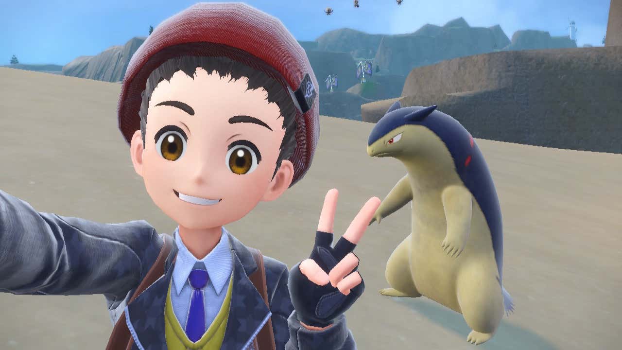 A trainer takes a selfie with a Typhlosion